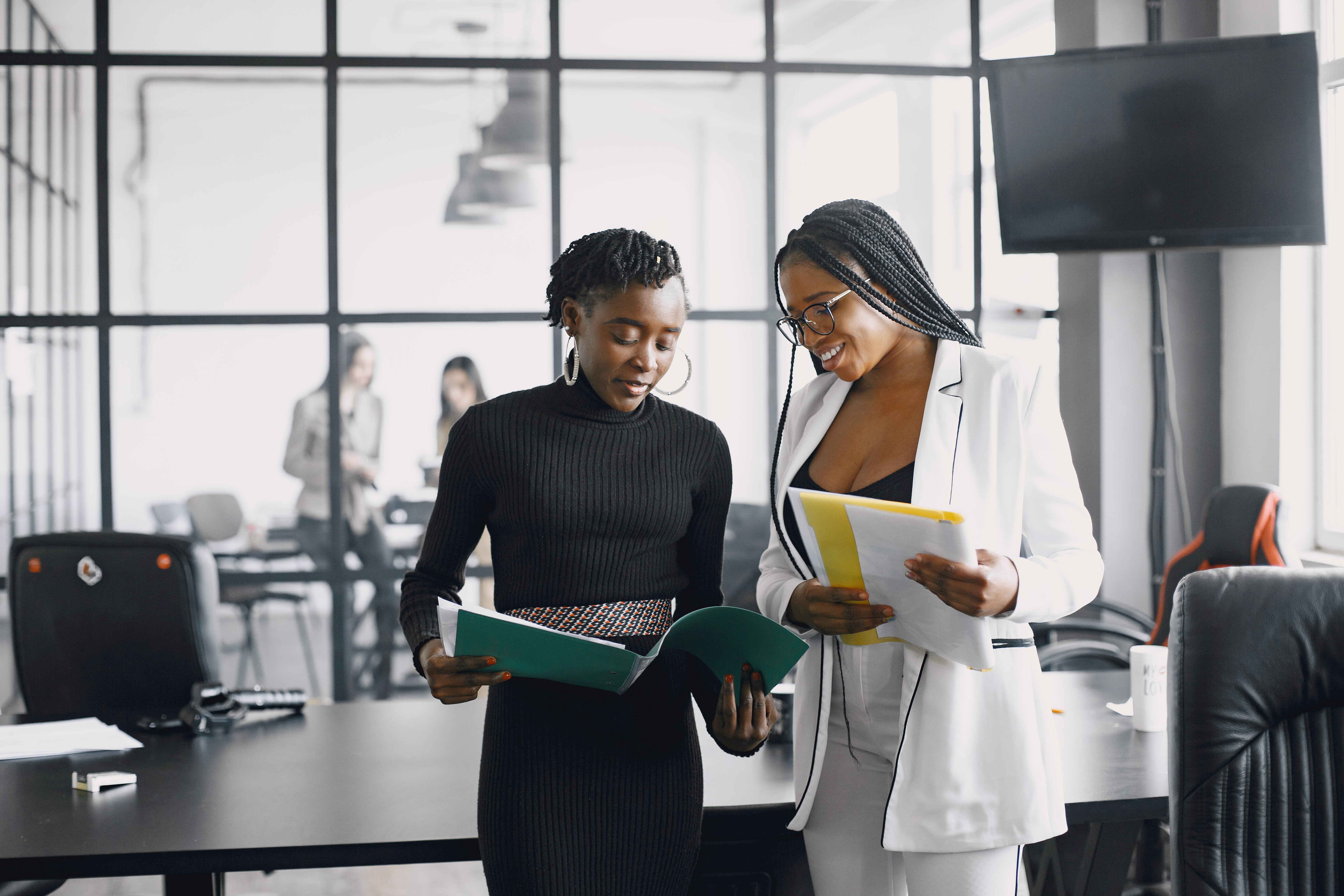 African professional team reviewing loan application process