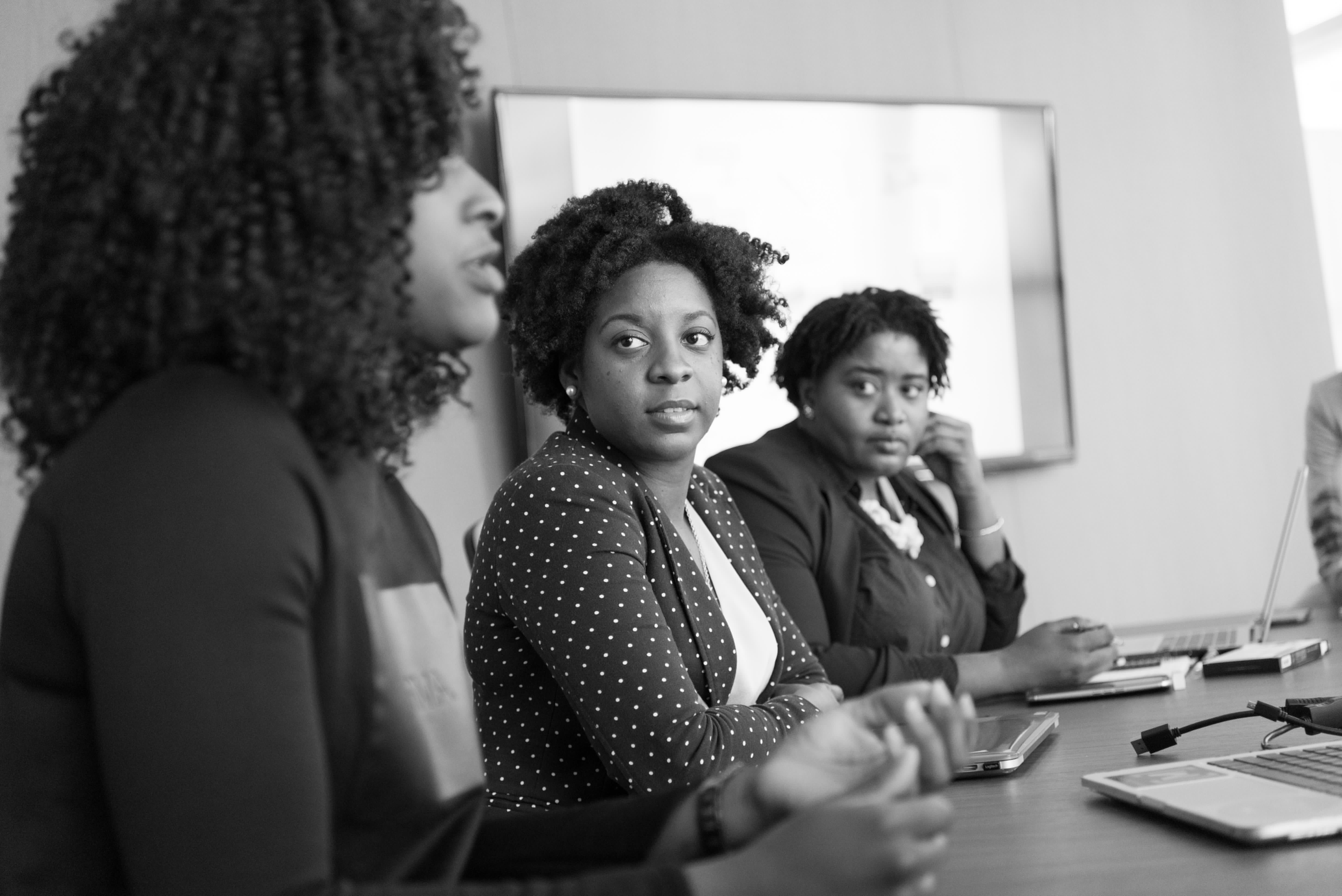 African female executive leading strategic meeting